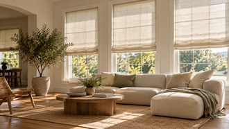 Living room styled with off-white Roman shades