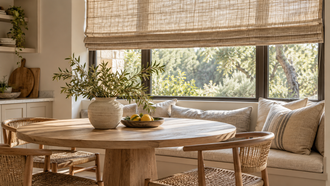 Textured fabric Roman shade in a bright breakfast nook