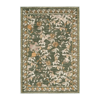 Vintage pomegranate foliage floral area rug in a styled room