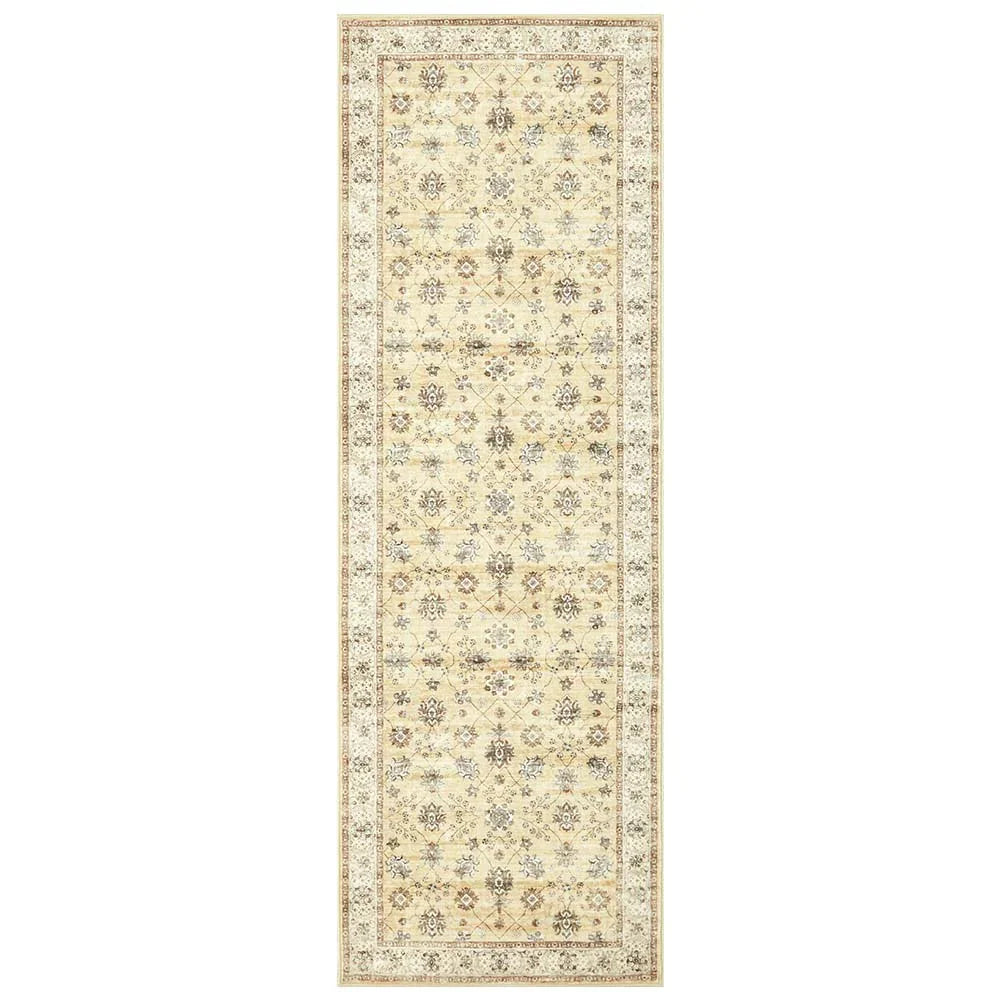 Beige and cream floral patterned runner rug with ornate border and vintage design