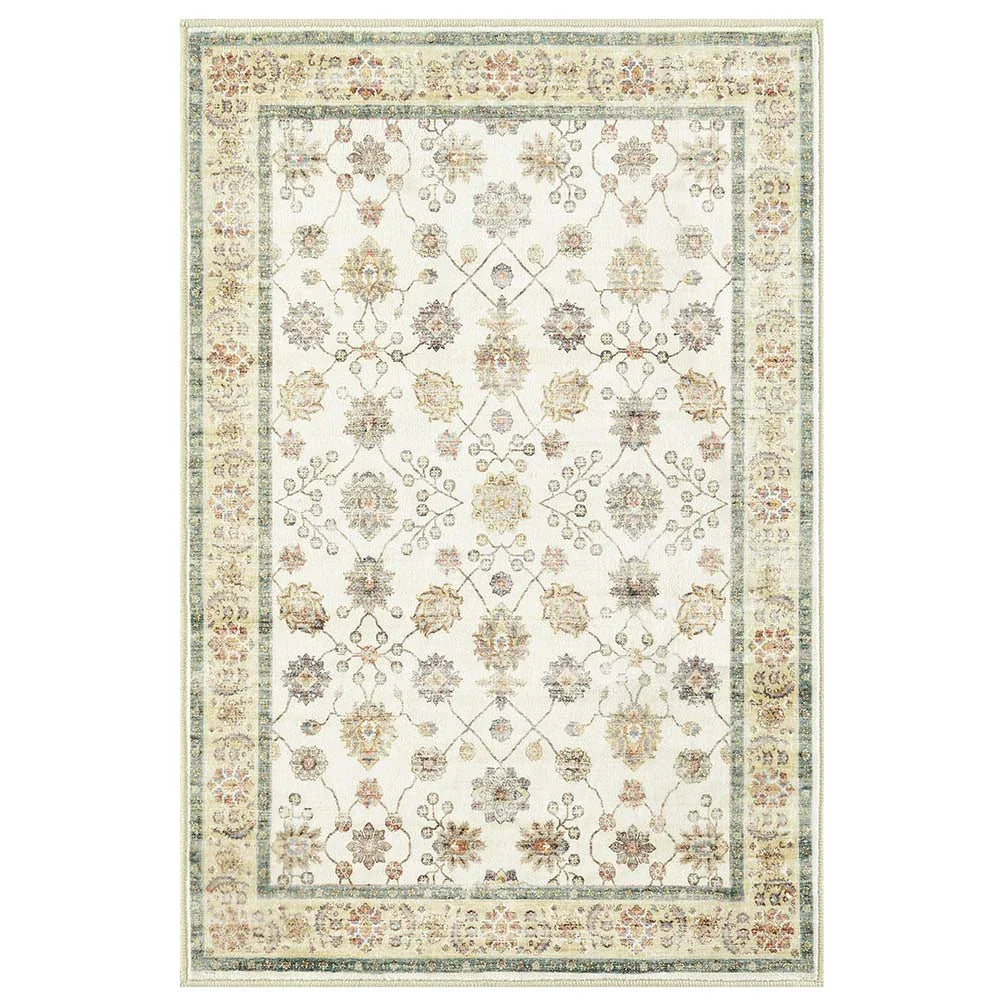 Traditional beige and pastel floral patterned area rug with decorative border